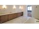 A well-lit bathroom features double sinks, stylish fixtures and a neutral color palette, enhancing a spa-like atmosphere at 7621 Falls Creek Ln, Raleigh, NC 27614