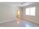 Bright bedroom with a view to the bathroom next to a large window combines style and convenience in the space at 7621 Falls Creek Ln, Raleigh, NC 27614