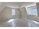 Sun-filled bedroom with pitched ceilings and multiple windows offering ample natural light and a cozy atmosphere at 7621 Falls Creek Ln, Raleigh, NC 27614