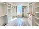 Spacious walk-in closet with custom shelving and ample storage, offering luxurious organization and convenience at 7621 Falls Creek Ln, Raleigh, NC 27614
