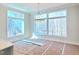Bright dining area with large windows providing natural light and a view of the outdoors at 7621 Falls Creek Ln, Raleigh, NC 27614