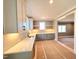 Modern kitchen with white cabinets, countertops and stainless steel sink offer contemporary style and functionality at 7621 Falls Creek Ln, Raleigh, NC 27614