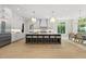 Gourmet kitchen with a large island, stainless steel appliances, and stylish pendant lighting at 7621 Falls Creek Ln, Raleigh, NC 27614