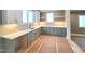 Modern kitchen features sleek cabinets, quartz counters, and plenty of storage space, creating a gourmet experience at 7621 Falls Creek Ln, Raleigh, NC 27614