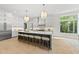 Spacious kitchen featuring a large island, custom cabinetry, and an abundance of natural light at 7621 Falls Creek Ln, Raleigh, NC 27614