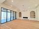 Bright living room with sliding glass doors leading to an outdoor deck, built-in shelving, and decorative ceiling at 7621 Falls Creek Ln, Raleigh, NC 27614