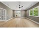 Inviting living room with hardwood floors, neutral paint, and great natural light at 7621 Falls Creek Ln, Raleigh, NC 27614