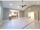 Open-concept living area with vaulted ceilings and view to the kitchen, creating an airy and inviting atmosphere at 7621 Falls Creek Ln, Raleigh, NC 27614