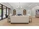 Inviting living room offers a stunning fireplace, sleek lighting, and an open layout perfect for entertaining at 7621 Falls Creek Ln, Raleigh, NC 27614