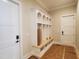 Custom mudroom with storage cubbies, bench, and white trim work at 7621 Falls Creek Ln, Raleigh, NC 27614