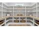 Spacious walk-in pantry with custom built-in shelving and plenty of room for organized storage at 7621 Falls Creek Ln, Raleigh, NC 27614