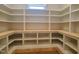 Large walk-in pantry with custom shelving providing ample storage space at 7621 Falls Creek Ln, Raleigh, NC 27614