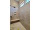 Walk-in shower with rainfall showerhead, seating and modern fixtures at 7621 Falls Creek Ln, Raleigh, NC 27614
