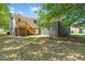 Spacious backyard with a deck and lush greenery, perfect for outdoor entertaining at 1844 Brier Ln, Graham, NC 27253