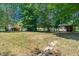 Large lot with mature trees, two outbuildings and back porch at 1844 Brier Ln, Graham, NC 27253