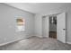 This bedroom features neutral walls, carpet, and a bright window at 1844 Brier Ln, Graham, NC 27253