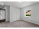 This bedroom features neutral walls, carpet, and a bright window at 1844 Brier Ln, Graham, NC 27253