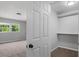 Bedroom and walk-in closet area featuring neutral colors and carpet floors at 1844 Brier Ln, Graham, NC 27253