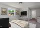 Well-lit bedroom featuring neutral colors, modern furnishings, and a view of the outside at 1844 Brier Ln, Graham, NC 27253
