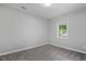 This bedroom features neutral walls, carpet, and a bright window at 1844 Brier Ln, Graham, NC 27253