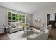 Inviting living room with a large bay window, neutral decor, and hardwood floors, perfect for relaxing at 1844 Brier Ln, Graham, NC 27253