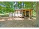 Outbuildings including covered patio with built-in shelving at 1844 Brier Ln, Graham, NC 27253