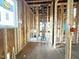New bathroom is under construction with window and visible framing and plumbing at 2728 Trifle Ln, Wake Forest, NC 27587