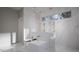 Luxurious bathroom with a soaking tub, double vanity, marble floors, and large windows for natural light at 2728 Trifle Ln, Wake Forest, NC 27587