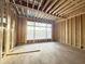 The bedroom is under construction and features large windows offering a view of the landscape at 2728 Trifle Ln, Wake Forest, NC 27587