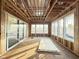 Sunroom interior framing with a slider, large windows, and wood studs at 2728 Trifle Ln, Wake Forest, NC 27587