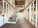 Interior framing of a two-story home featuring a staircase and light-filled rooms at 2728 Trifle Ln, Wake Forest, NC 27587