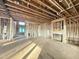 Spacious living room with fireplace under construction showcases an open floor plan and natural light at 2728 Trifle Ln, Wake Forest, NC 27587