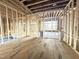 Spacious living room is under construction, showcasing an open layout and large windows at 2728 Trifle Ln, Wake Forest, NC 27587