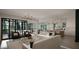 Open-concept living room with stylish furniture, hardwood floors, and sliding glass doors to an outdoor patio at 2728 Trifle Ln, Wake Forest, NC 27587
