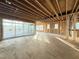 Bright living room under construction features a large sliding glass door and ample natural light at 2728 Trifle Ln, Wake Forest, NC 27587