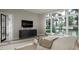 Bright main bedroom with large windows offering a great view, hardwood floors, and sitting area at 2728 Trifle Ln, Wake Forest, NC 27587