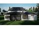 Stunning rear exterior showcasing a modern design with large windows and a screened porch at 2728 Trifle Ln, Wake Forest, NC 27587