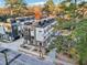 Aerial view of modern townhouses with private rooftop decks and tree-lined streets at 513 Edgecreek Ct, Raleigh, NC 27604