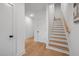 Modern staircase with light wood treads and white risers at 513 Edgecreek Ct, Raleigh, NC 27604