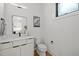 Clean bathroom with modern vanity and toilet at 515 Edgecreek Ct, Raleigh, NC 27604