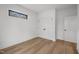 Simple bedroom with hardwood floors and a window at 515 Edgecreek Ct, Raleigh, NC 27604