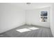 Well-lit bedroom with neutral decor and carpet flooring at 1505 Underbrush Dr, Durham, NC 27703