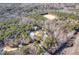 Aerial view of house on wooded lot, showcasing expansive property and privacy at 406 Terry Rd, Hillsborough, NC 27278