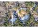 Aerial view showing home's location on wooded lot with a curved driveway at 406 Terry Rd, Hillsborough, NC 27278