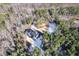 Aerial view of house nestled in wooded lot with circular driveway at 406 Terry Rd, Hillsborough, NC 27278