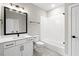 Modern bathroom with white subway tile, a white vanity, and a bathtub at 406 Terry Rd, Hillsborough, NC 27278