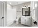 Clean bathroom with white subway tile, vanity, and bathtub at 406 Terry Rd, Hillsborough, NC 27278