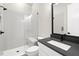 Bathroom with walk-in shower, built-in bench, and dark vanity at 406 Terry Rd, Hillsborough, NC 27278