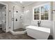 Modern bathroom boasts a soaking tub and a walk-in shower at 406 Terry Rd, Hillsborough, NC 27278
