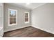 Bright bedroom with hardwood floors and large windows at 406 Terry Rd, Hillsborough, NC 27278